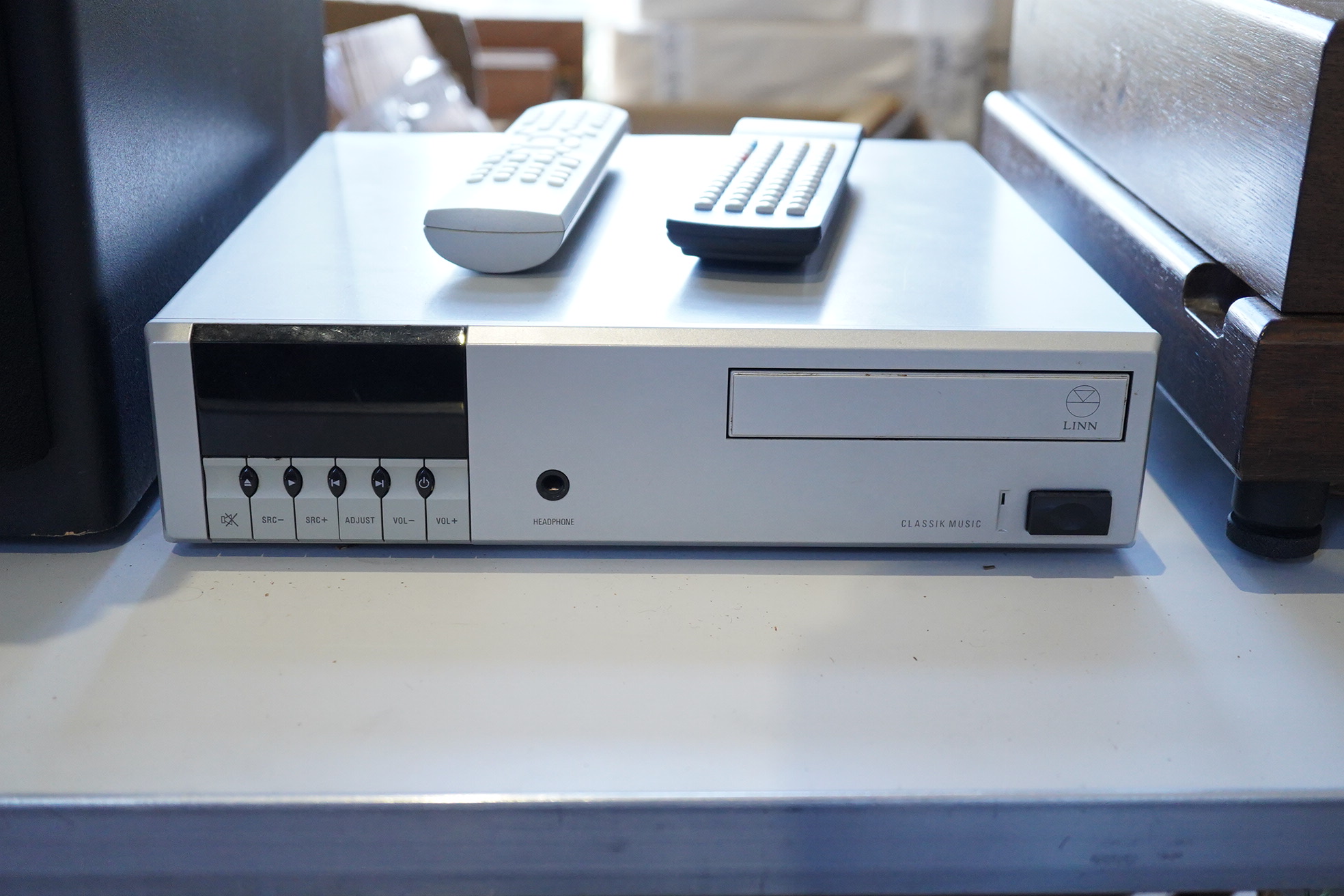 A Linn Classik Music combination CD player, tuner and amplifier in silver finished case, together with two remote controls